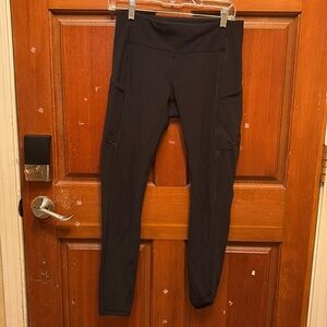 Lululemon classic black leggings. Size 8. Pocket on side. Zip in back